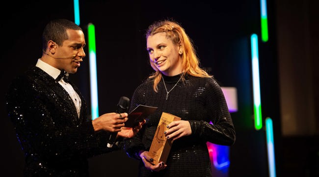Kara Williams receiving her swimming teacher of the year award