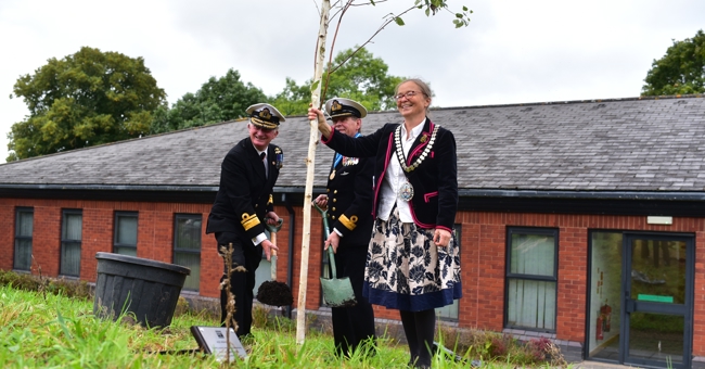 East Devon District Council's Chair planting a tree
