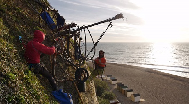 The netting being put in place will help stabilise the cliffs and reduce the risk to the public from falling debris