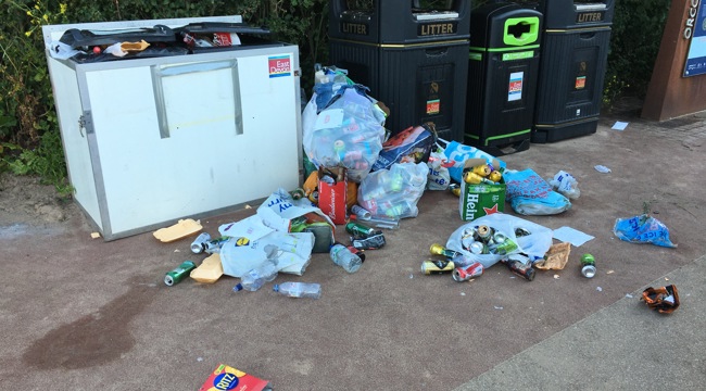 Overflowing litter bin at Orcombe Point