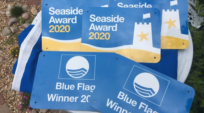 Yellow and blue depicting 2020 Blue Flag Awards and Seaside awards
