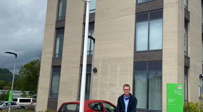 Cllr Joe Whibley at Blackdown House with the Pride Flag flying
