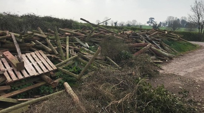 A huge amount of wood, gates and roofing material was left strewn across a large area in Beare Lane, in Budlake – near Killerton Park.