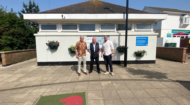 East Devon District Councillors Jack Rowland, Paul Arnott and Dan Ledger outside the Seaton toilets. 