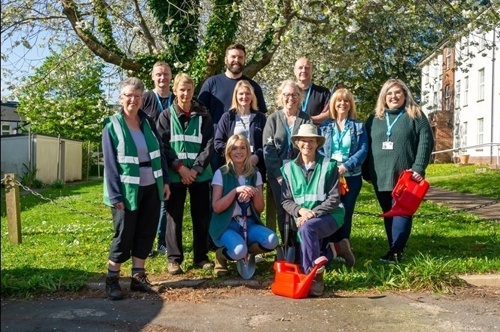 A picture of a group of EDDC Parks and Gardens volunteers posing as a group