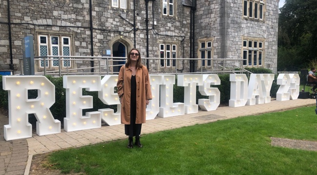 Photo of Councillor Violet Bonetta with 'Results Day 23' letters in the background