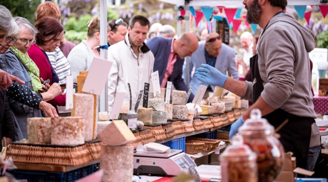 Photo of a busy market stall selling food