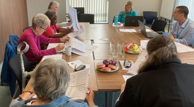 EDDC tenants and staff sat around a table for a training session