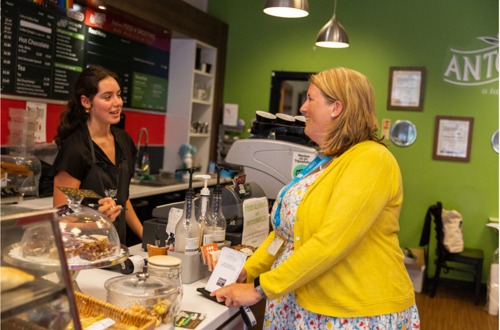 Image of two women at a cafe