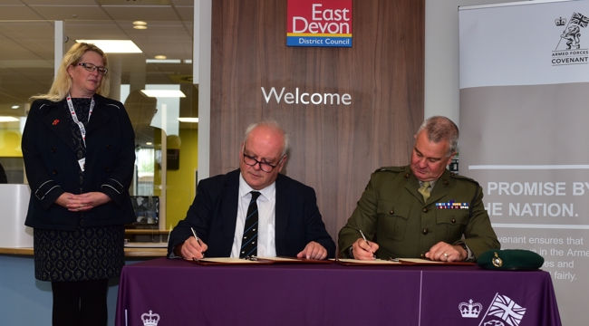 Councillor Paul Arnott, EDDC's Leader, and Major Mark Latham RM sign the Armed Forces Covenant