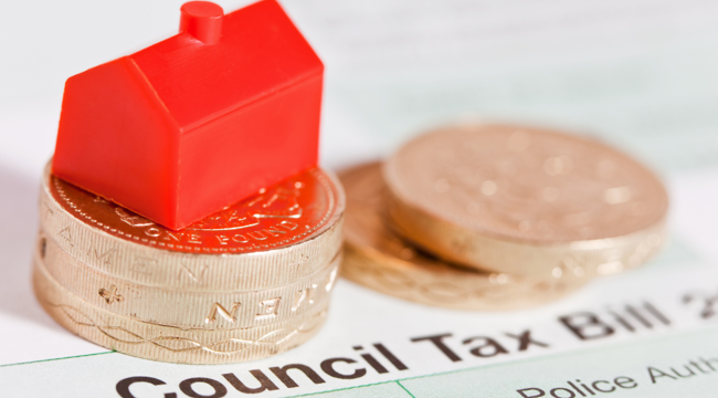 Council Tax coins and red house