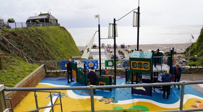 Beer play area. Ship play equipment. Beach and sea in the background