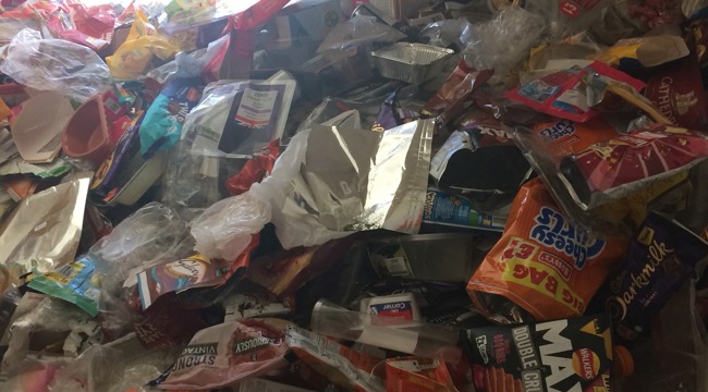Wrappers piled high inside a home.