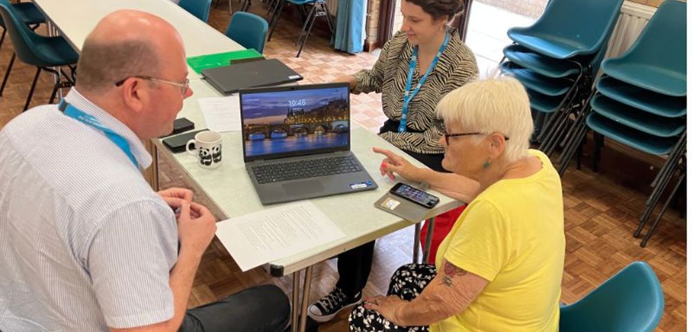 Officers talking to a tenant at a community centre