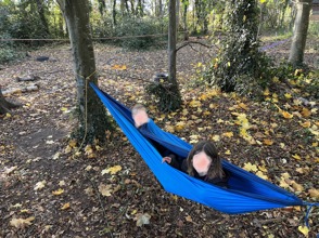 Children of Seaton Primary School sat in a hammock.