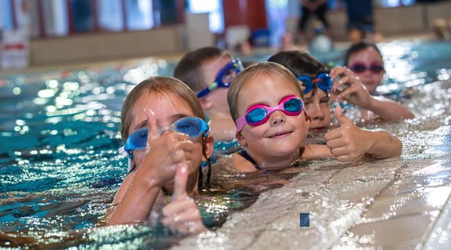 Children in indoor swimming pool