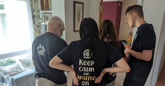 The Waffle House staff wearing 'keep calm and waffle on' uniform